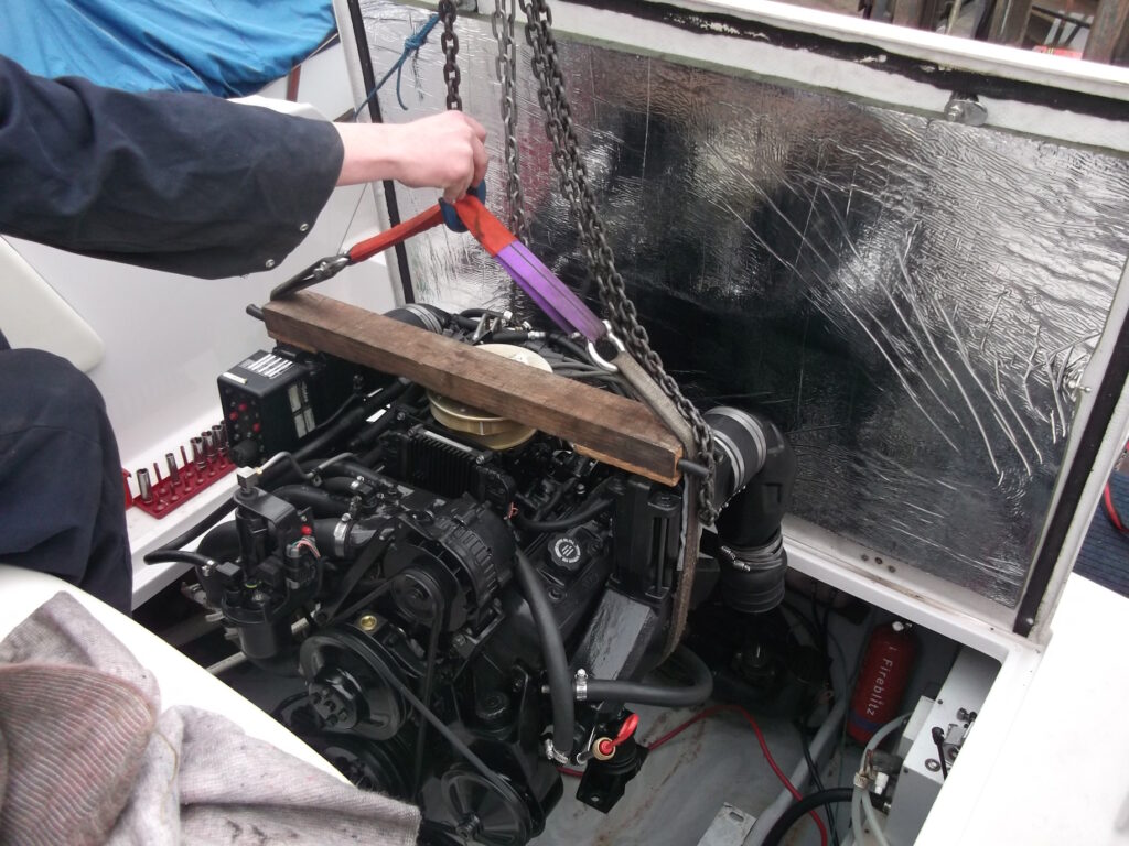 engine installation image of a boat engine being installed
